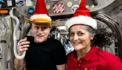 Astronauts Whose Return to Earth Was Delayed Make the Most of Their Holiday Season with Festive Photo from Space